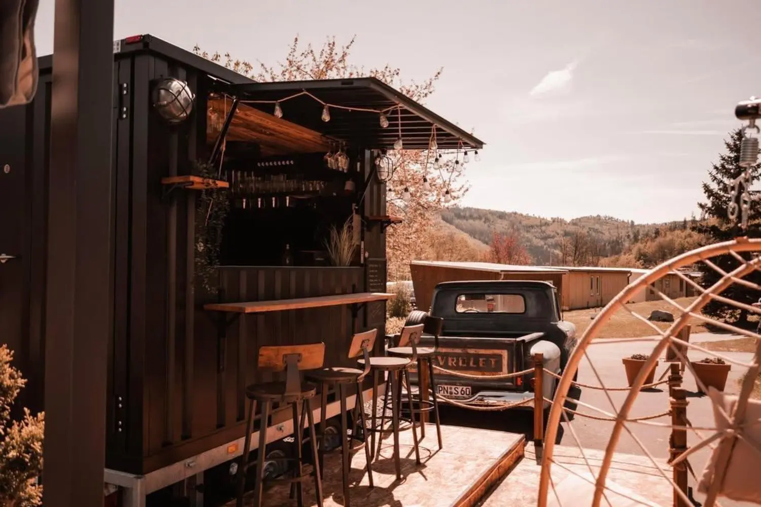 The original Hafenbar with the Chevy and seats on the lake.