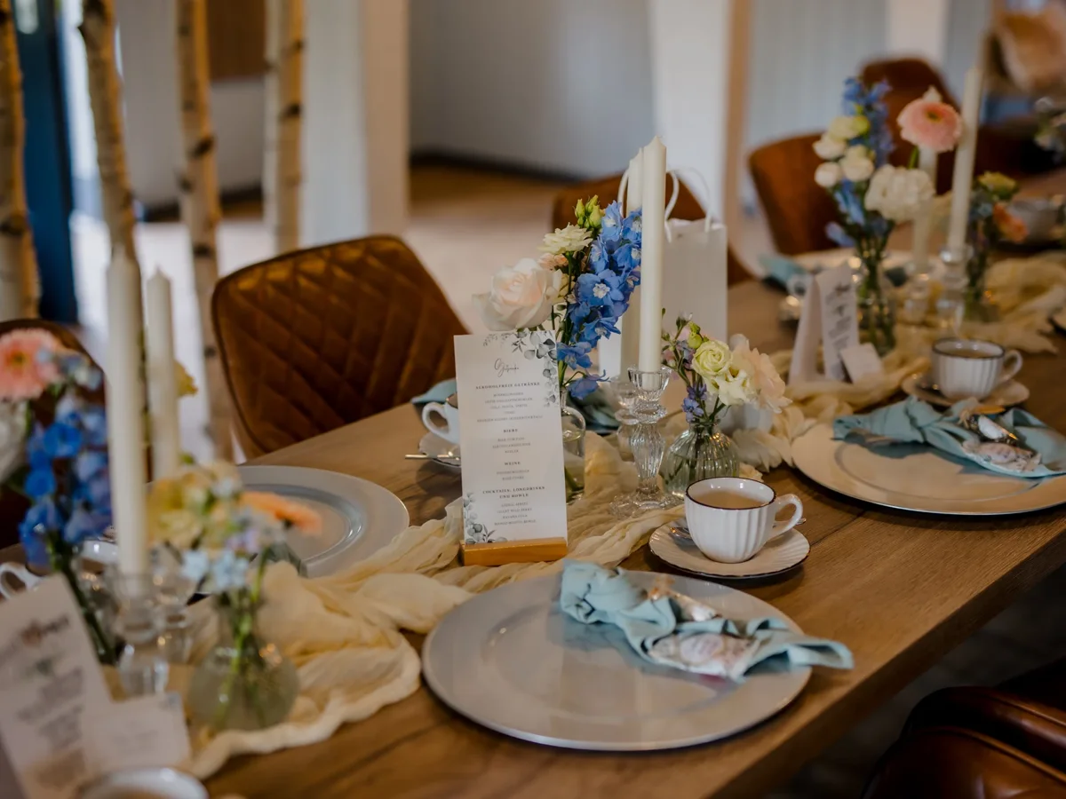 Set table with flowers and porcelain in the restaurant Schmiedehafen